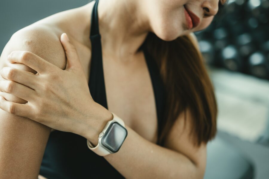 Physiotherapist assessing external rotation in a frozen shoulder patient